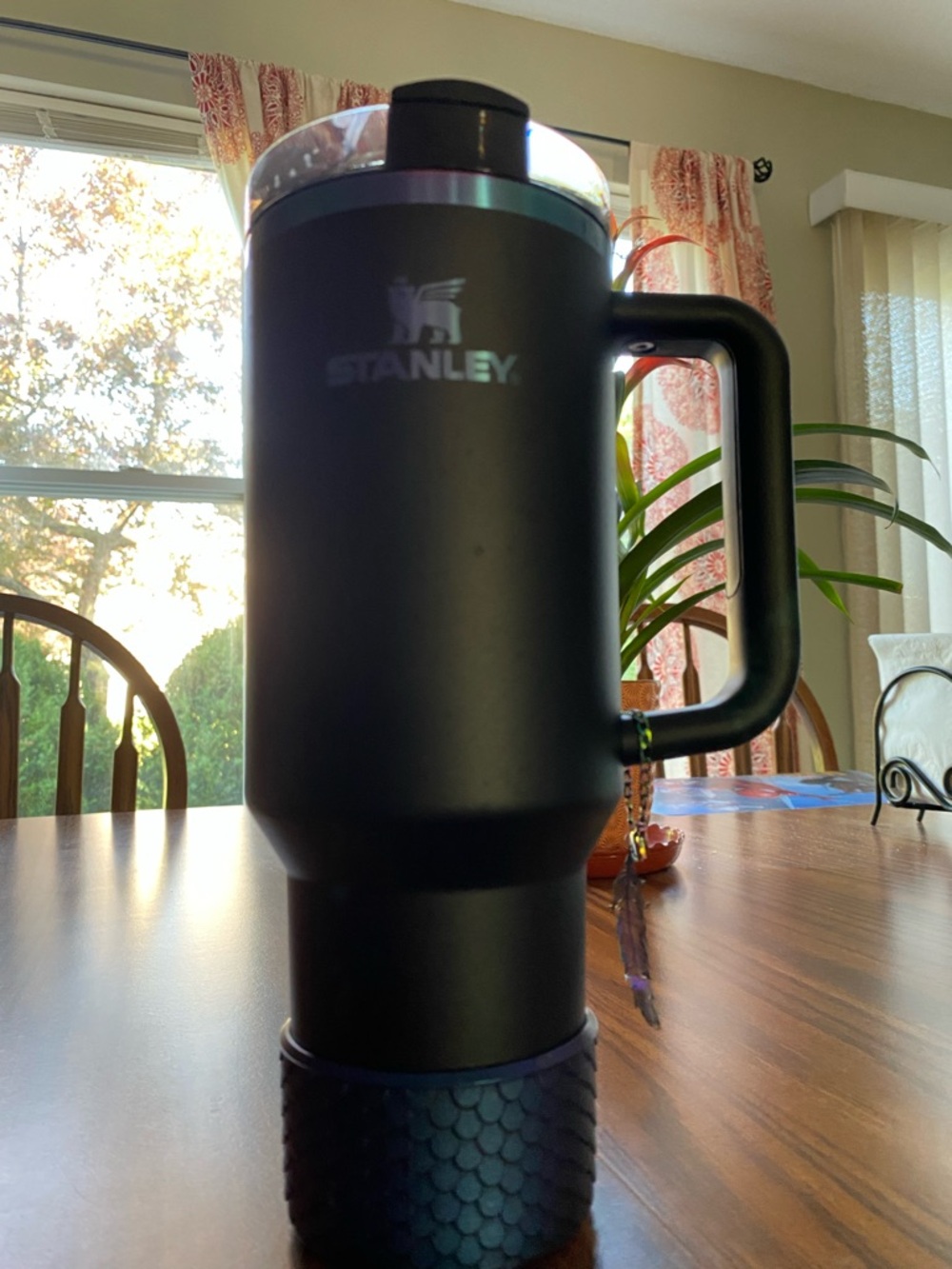Used once. Stanley Black Travel Tumbler with blue purple iridescent Logo
